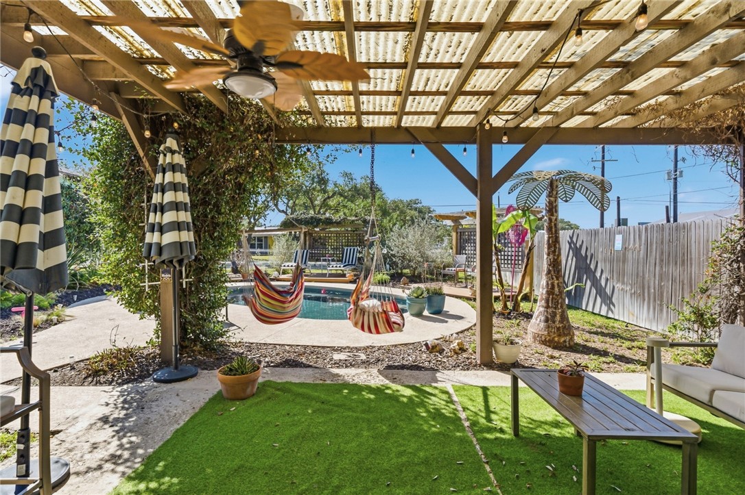 607 Chaparral Street Fulton, TX 78382 - Photo 32 of 40 a backyard of a house with seating space