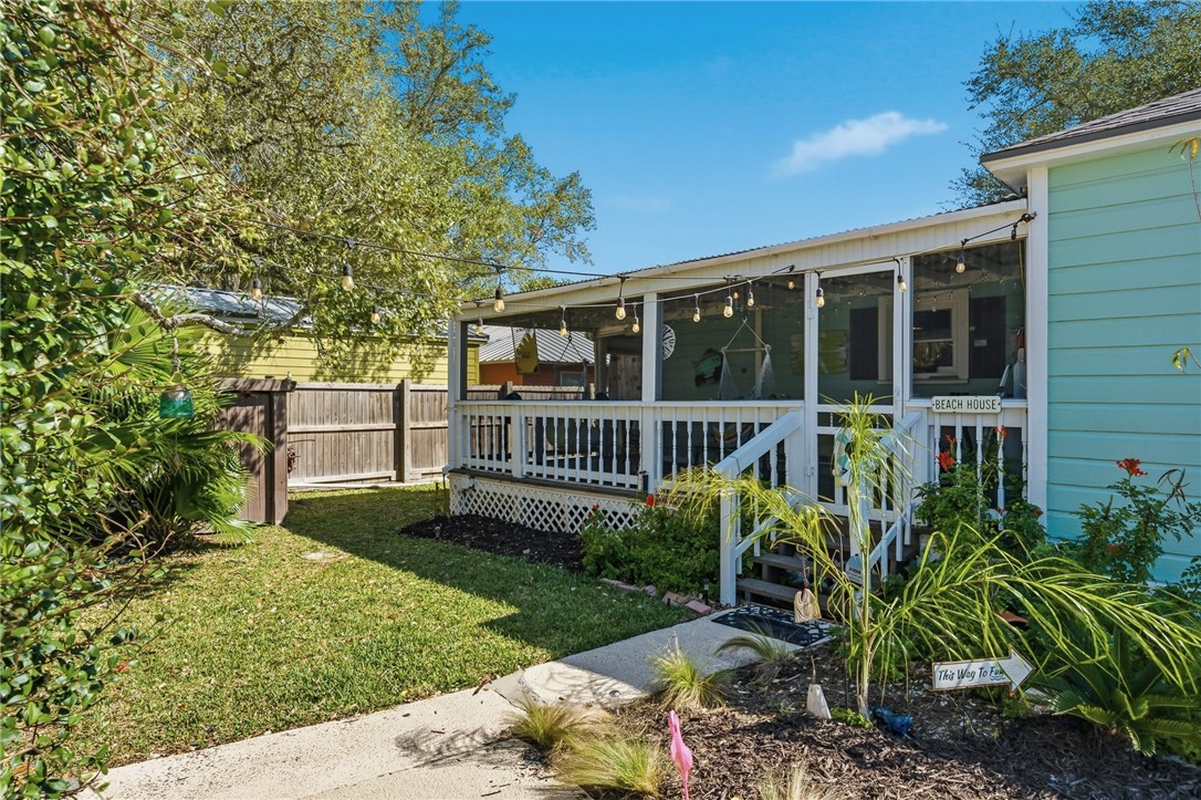 607 Chaparral Street Fulton, TX 78382 - Photo 33 of 40 a view of a house with a yard and potted plants