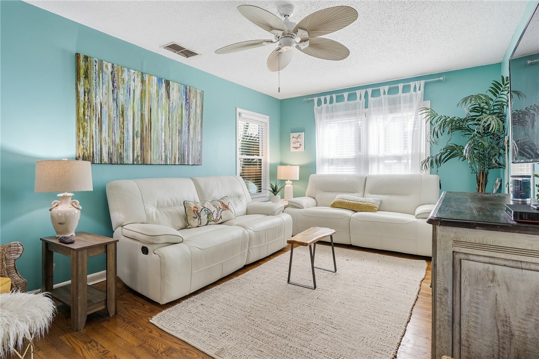 607 Chaparral Street Fulton, TX 78382 - Photo 5 of 40 a living room with furniture and a large window