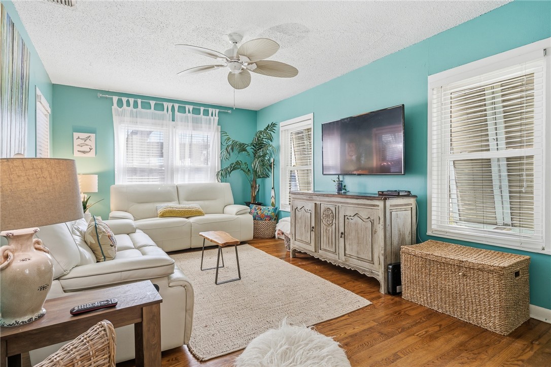 607 Chaparral Street Fulton, TX 78382 - Photo 6 of 40 a living room with furniture and a flat screen tv