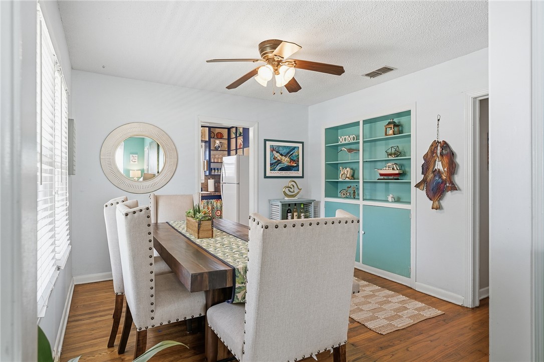607 Chaparral Street Fulton, TX 78382 - Photo 8 of 40 a view of a dining room with furniture and a chandelier fan