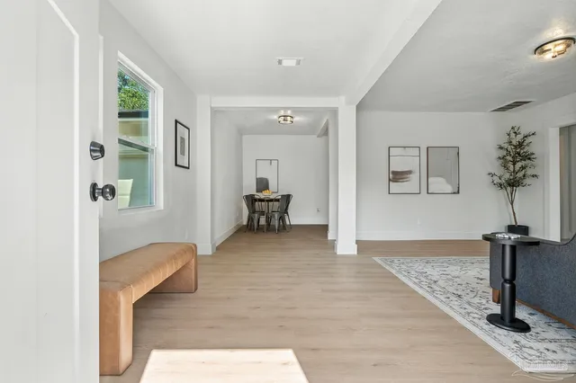 a view of hallway with livingroom and couch