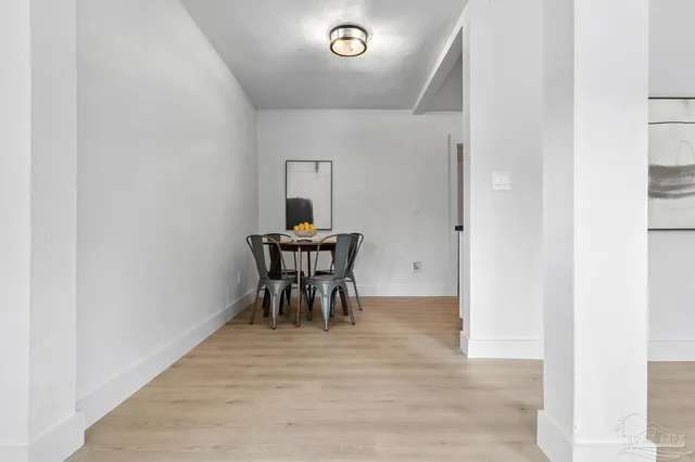 a view of dining room and livingroom with furniture
