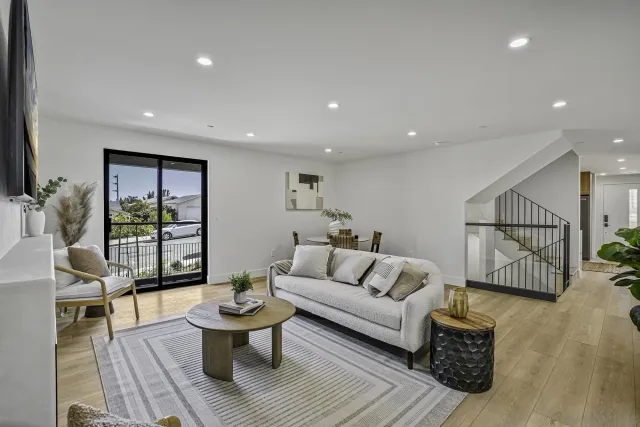 a living room with furniture and a table