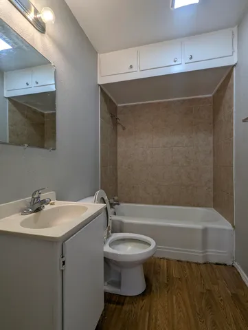 a bathroom with a sink a toilet and bathtub