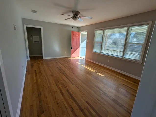 a view of an empty room with windows