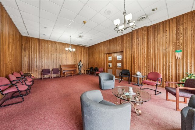 33 North Main Street, Unit 2E Lombard, IL 60148 - Photo 4 of 16 a living room with furniture and a large window