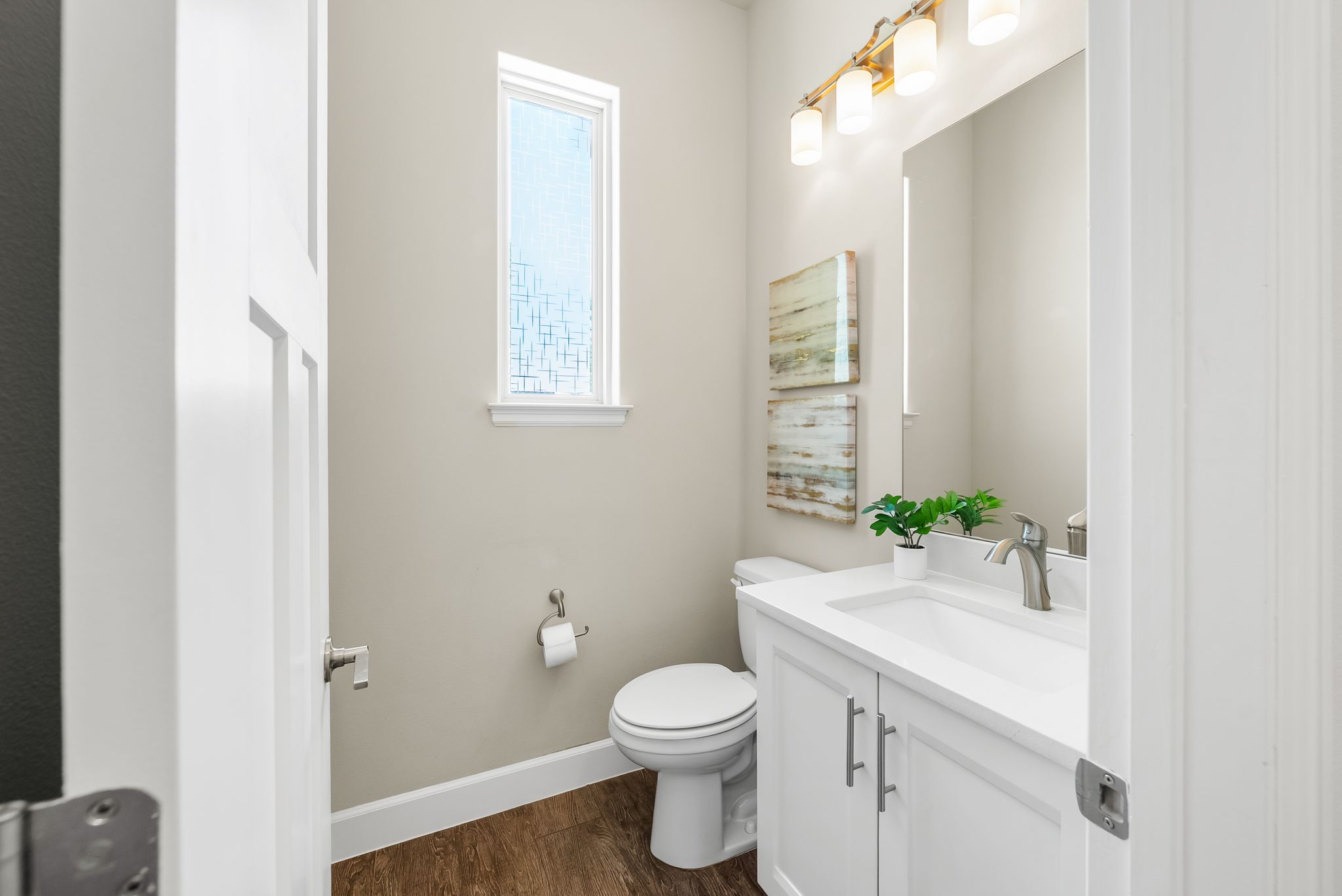 14213 Red Feather Trail Austin, TX 78734 - Photo 12 of 39 a bathroom with a granite countertop toilet a sink and a mirror