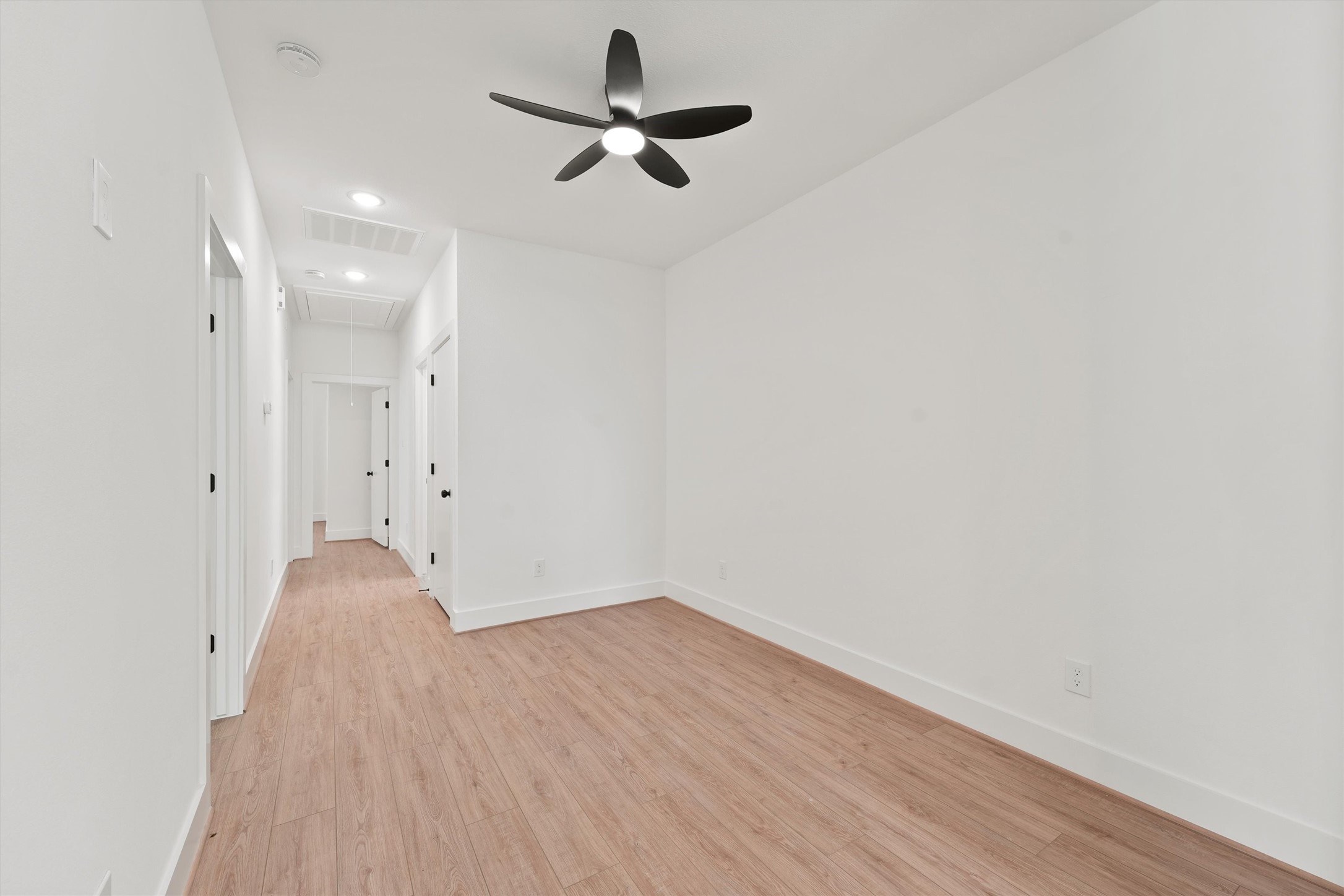 407 Calloway Street, Unit AB Houston, TX 77029 - Photo 3 of 19 a view of room with a ceiling fan and wooden floor