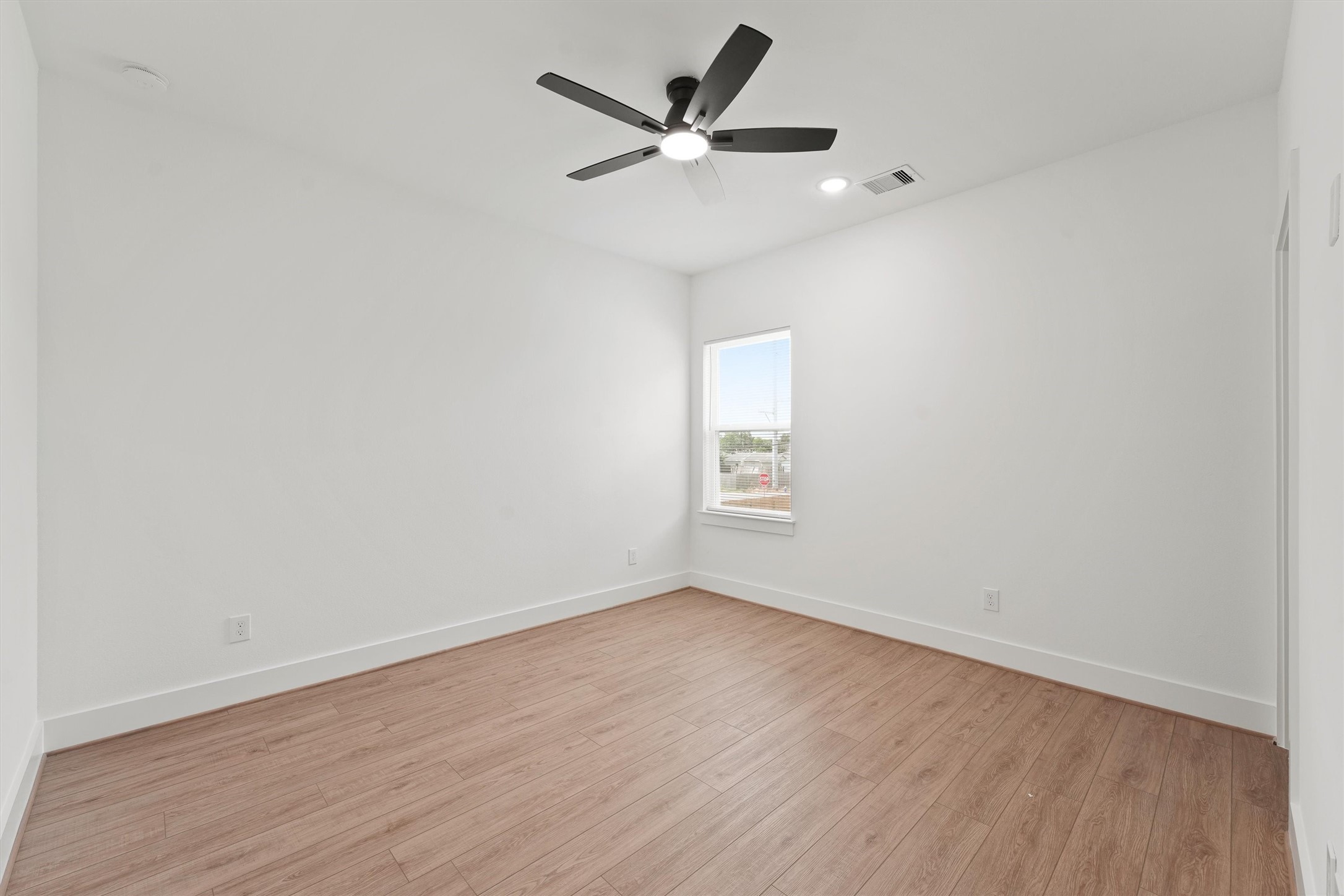 407 Calloway Street, Unit AB Houston, TX 77029 - Photo 6 of 19 wooden floor in an empty room