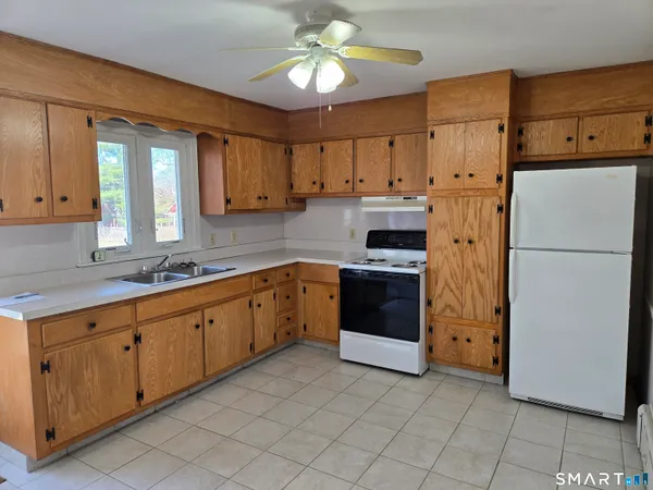 a kitchen with cabinets and stainless steel appliances