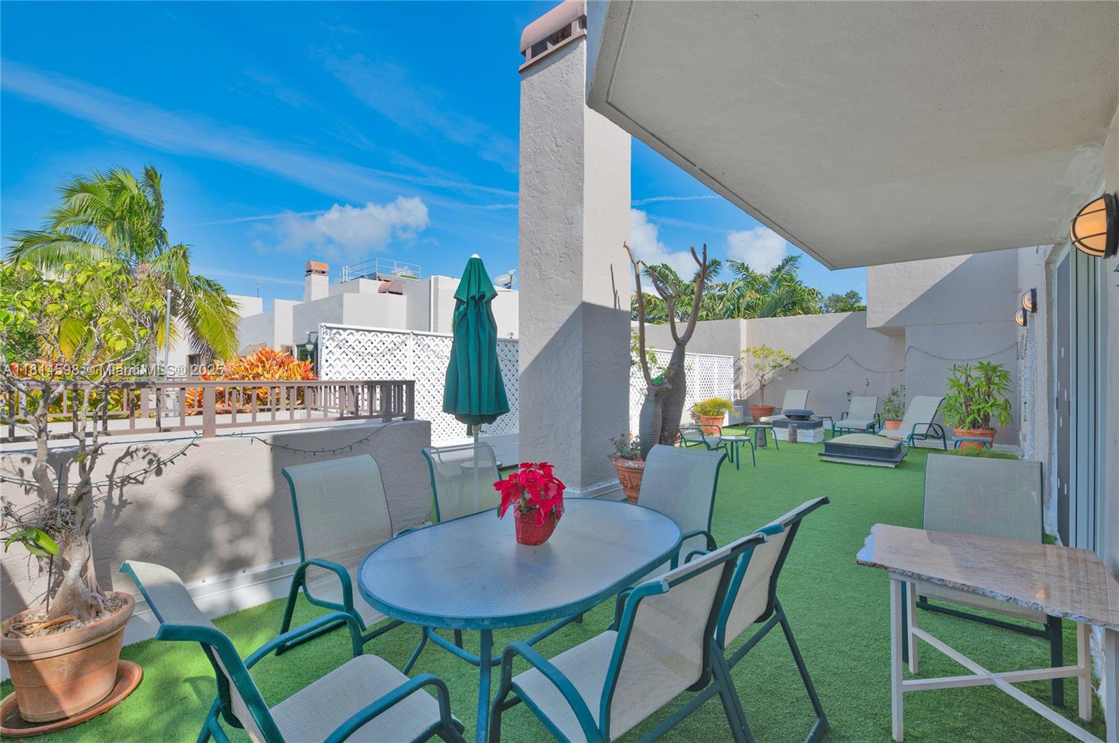 101 Crandon Boulevard, Unit 480 Key Biscayne, FL 33149 - Photo 11 of 28 a view of a dining room with furniture and a potted plant