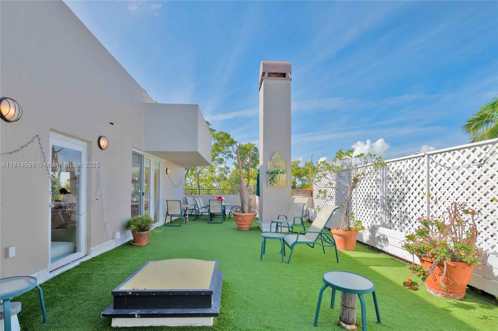 101 Crandon Boulevard, Unit 480 Key Biscayne, FL 33149 - Photo 12 of 28 a view of garden with patio