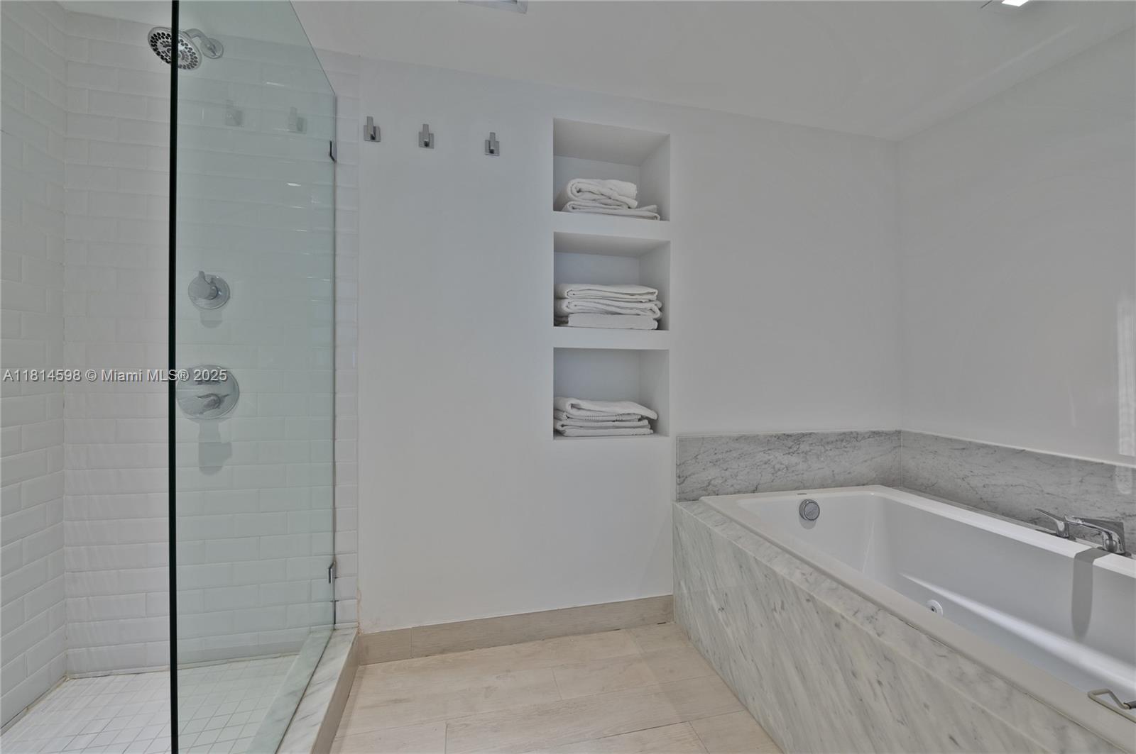 101 Crandon Boulevard, Unit 480 Key Biscayne, FL 33149 - Photo 17 of 28 a bathroom with a bathtub