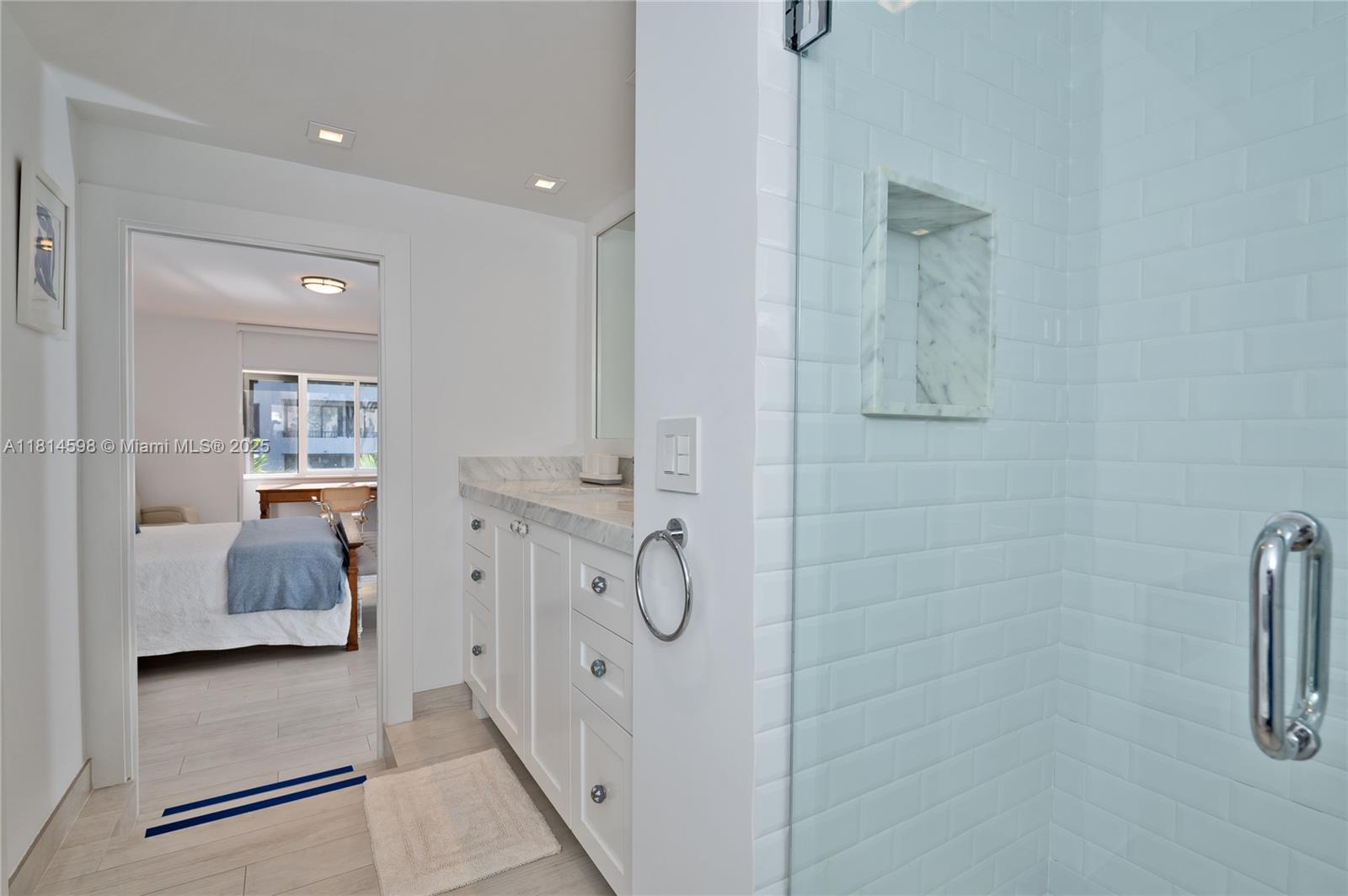 101 Crandon Boulevard, Unit 480 Key Biscayne, FL 33149 - Photo 18 of 28 a en suite bathroom with a shower