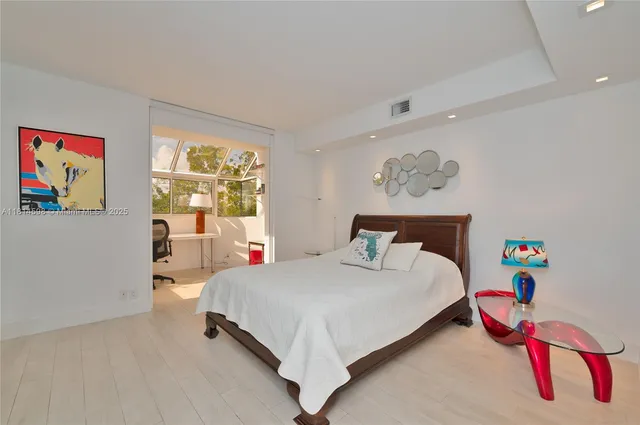 a bedroom with a bed and a couch