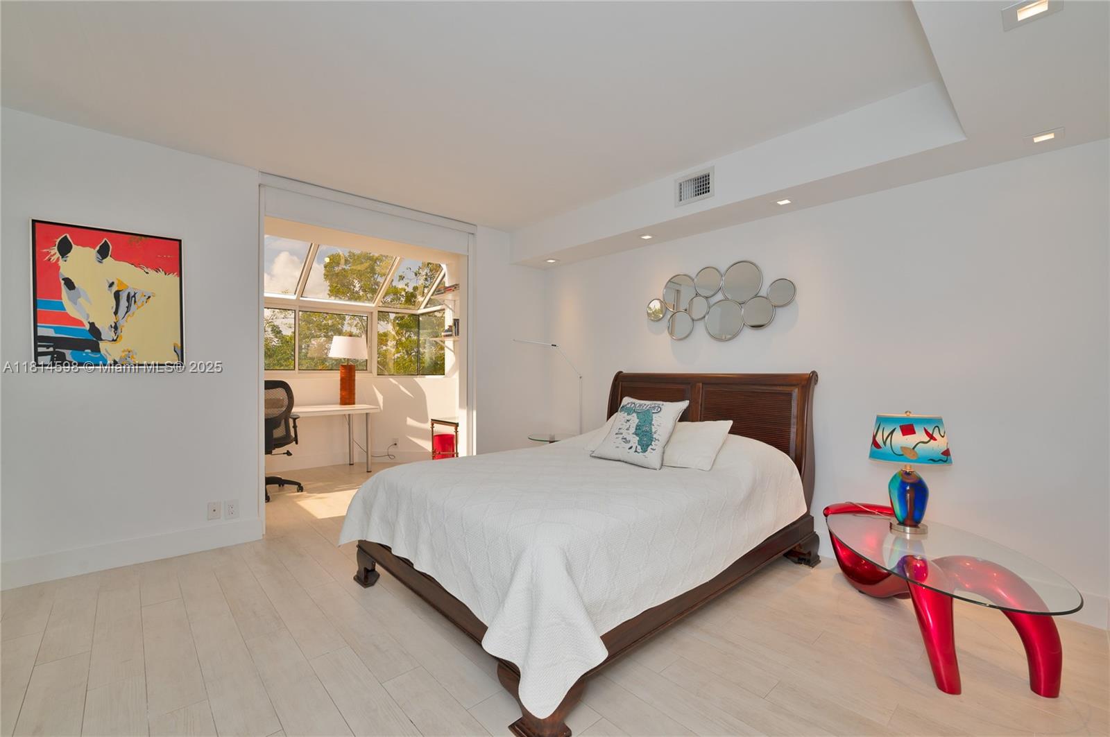 101 Crandon Boulevard, Unit 480 Key Biscayne, FL 33149 - Photo 19 of 28 a bedroom with a bed and a couch