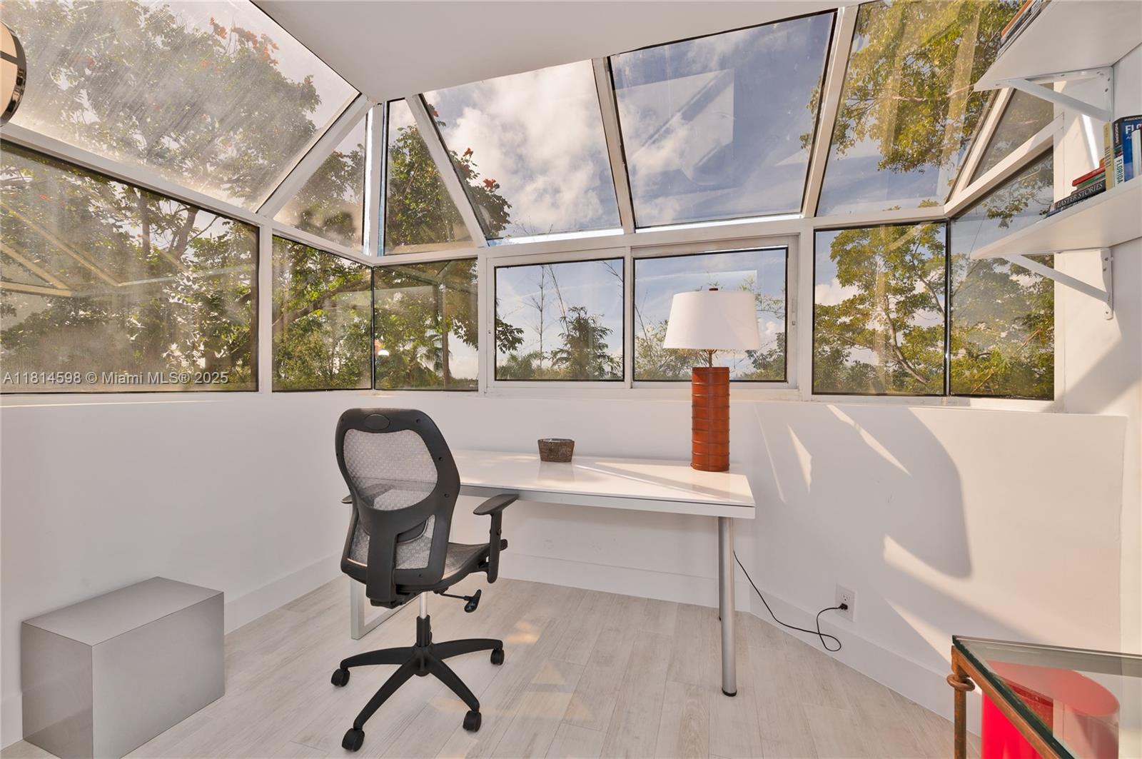 101 Crandon Boulevard, Unit 480 Key Biscayne, FL 33149 - Photo 20 of 28 a view of a workspace with furniture and a window