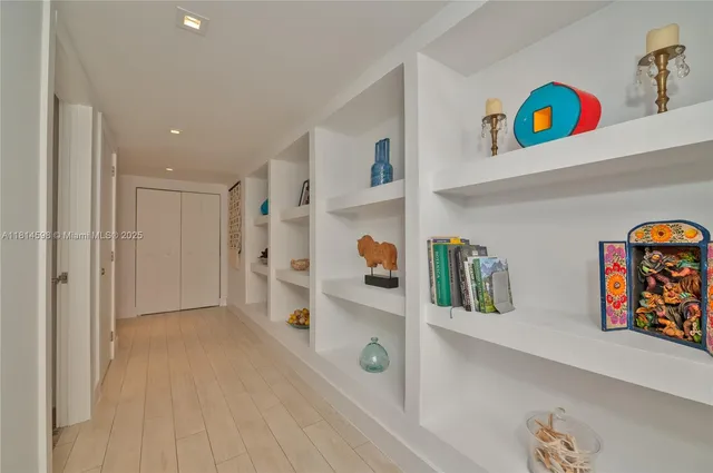 a view of an entryway with wooden floor