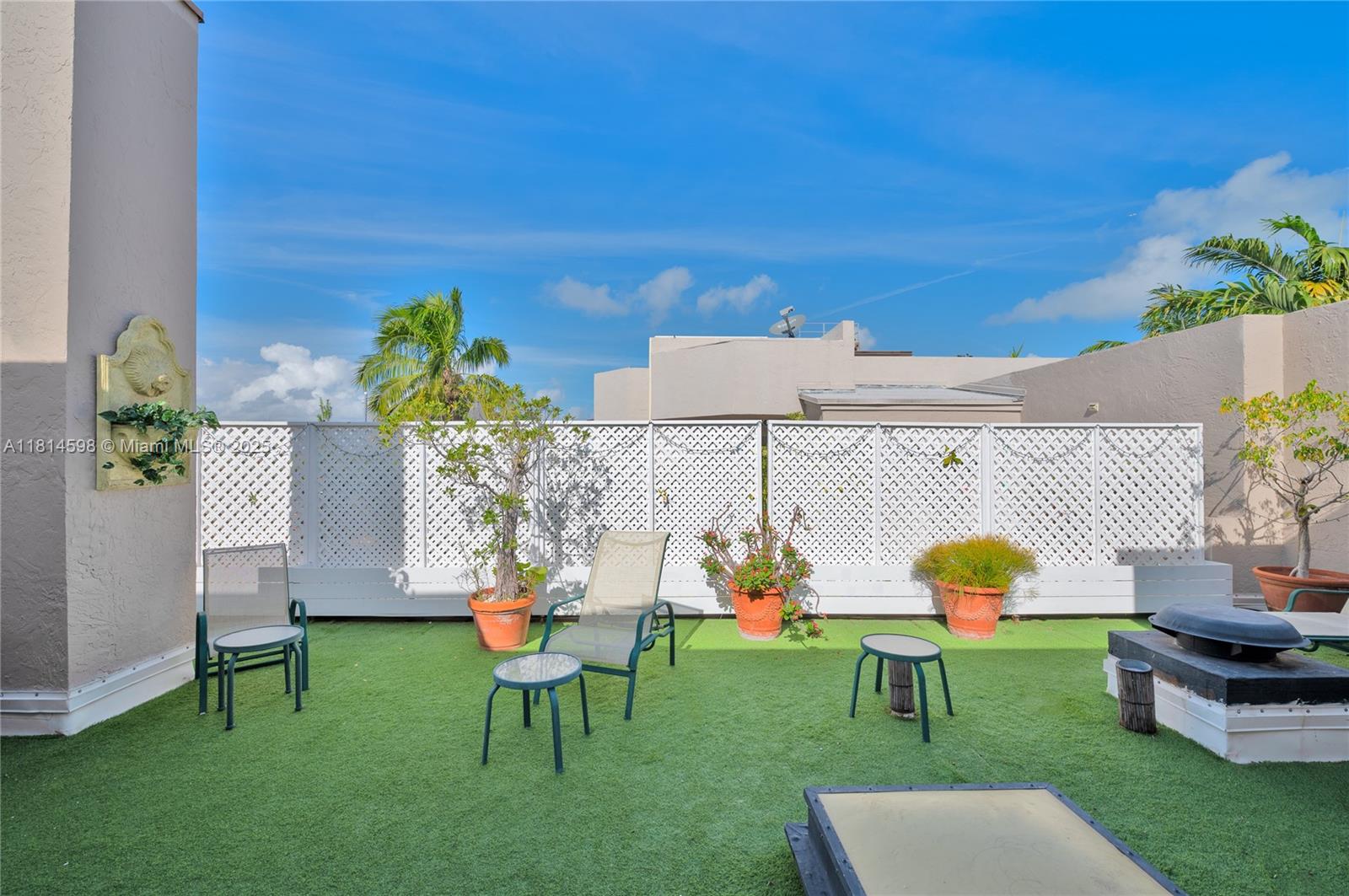 101 Crandon Boulevard, Unit 480 Key Biscayne, FL 33149 - Photo 9 of 28 a house view with a table and chairs