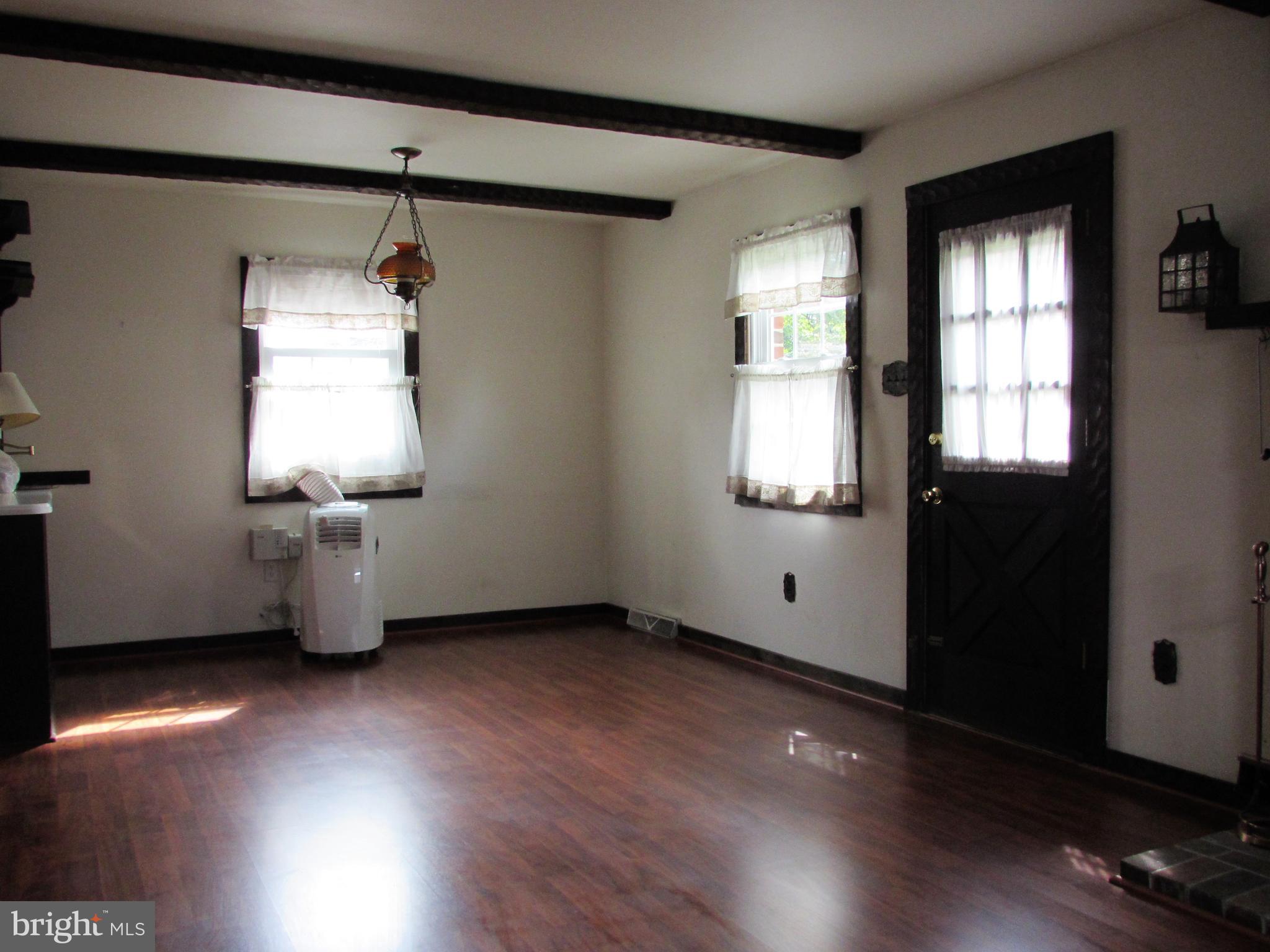 536 Sherman Road Springfield, PA 19064 - Photo 8 of 18 an empty room with wooden floor and windows