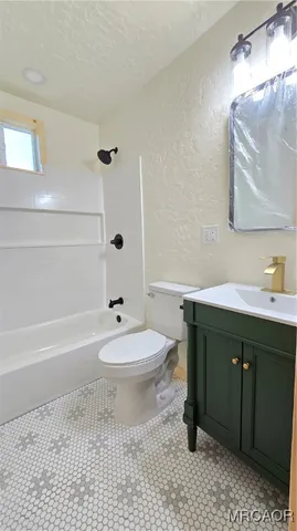 a bathroom with a toilet and a sink