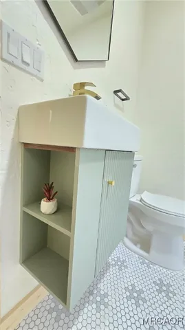 a stove top oven sitting inside of a kitchen