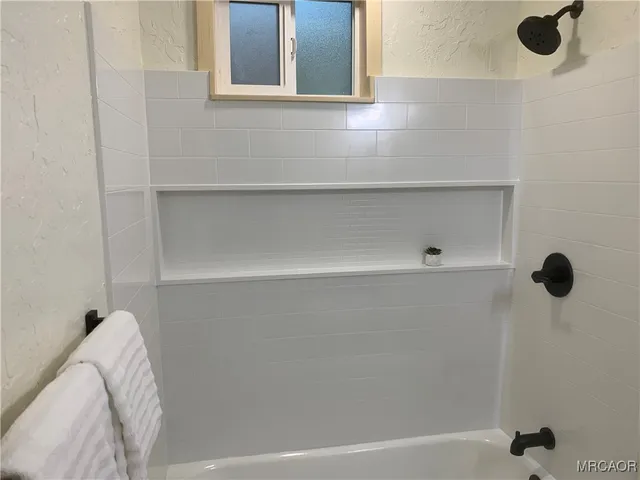 a view of a porch with wooden floor and stairs