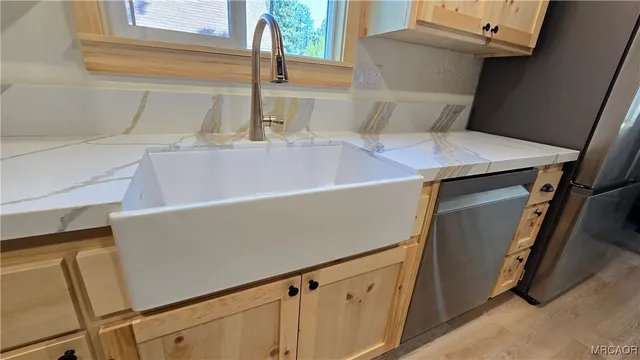 a view of a backyard of the house