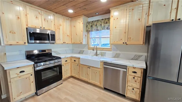 a living room with furniture and stairs