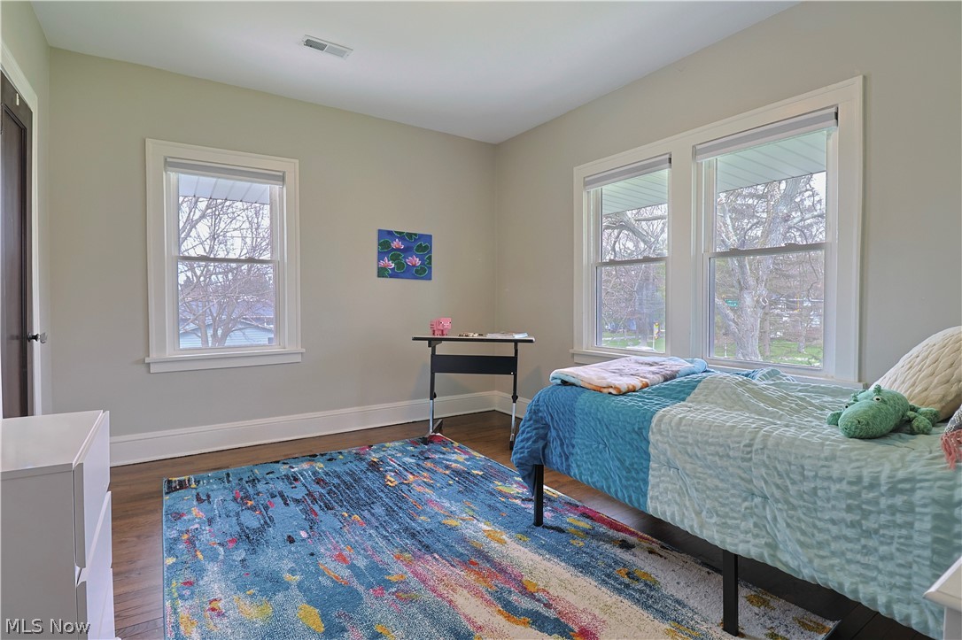 4376 Dover Center Road North Olmsted, OH 44070 - Photo 20 of 34 Bedroom featuring multiple windows and dark hardwood / wood-style floors