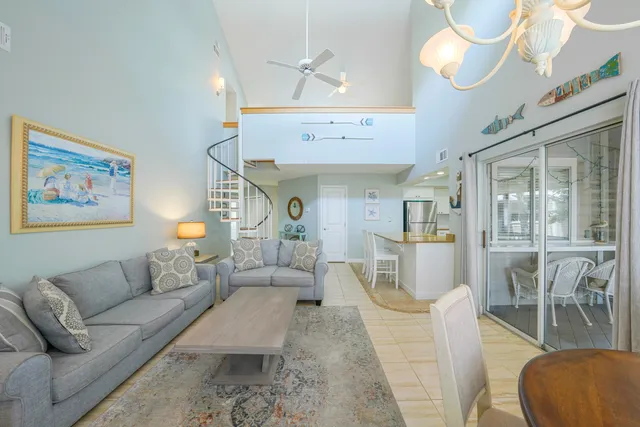 a outdoor dining space with furniture and wooden floor