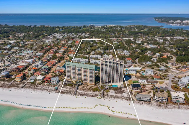 a street sign that is sitting on a brick wall