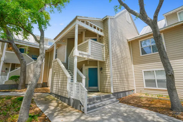a view of entryway dining room and hall with wooden floor