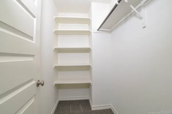 a view of an empty walk in closet