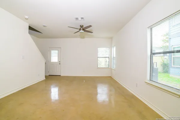 a view of an empty room with a window