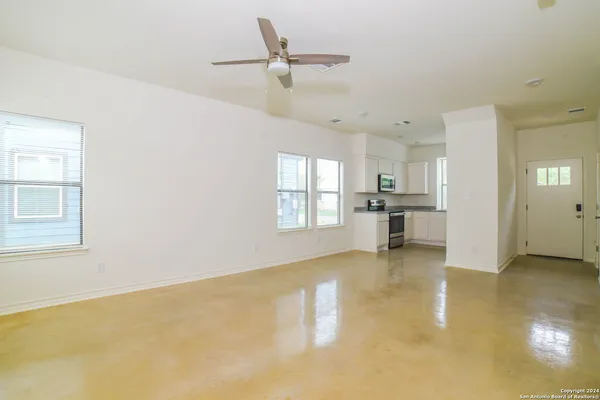 a view of an empty room with a window