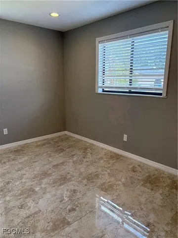 an empty room with closet area