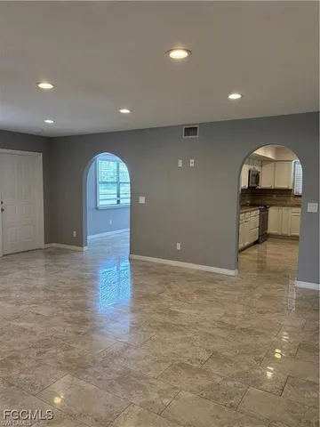 a view of an empty room and window