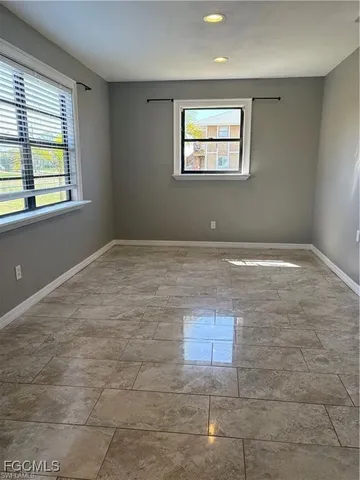 a large kitchen with stainless steel appliances granite countertop a stove a sink and a refrigerator