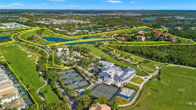 a view of a swimming pool with a yard
