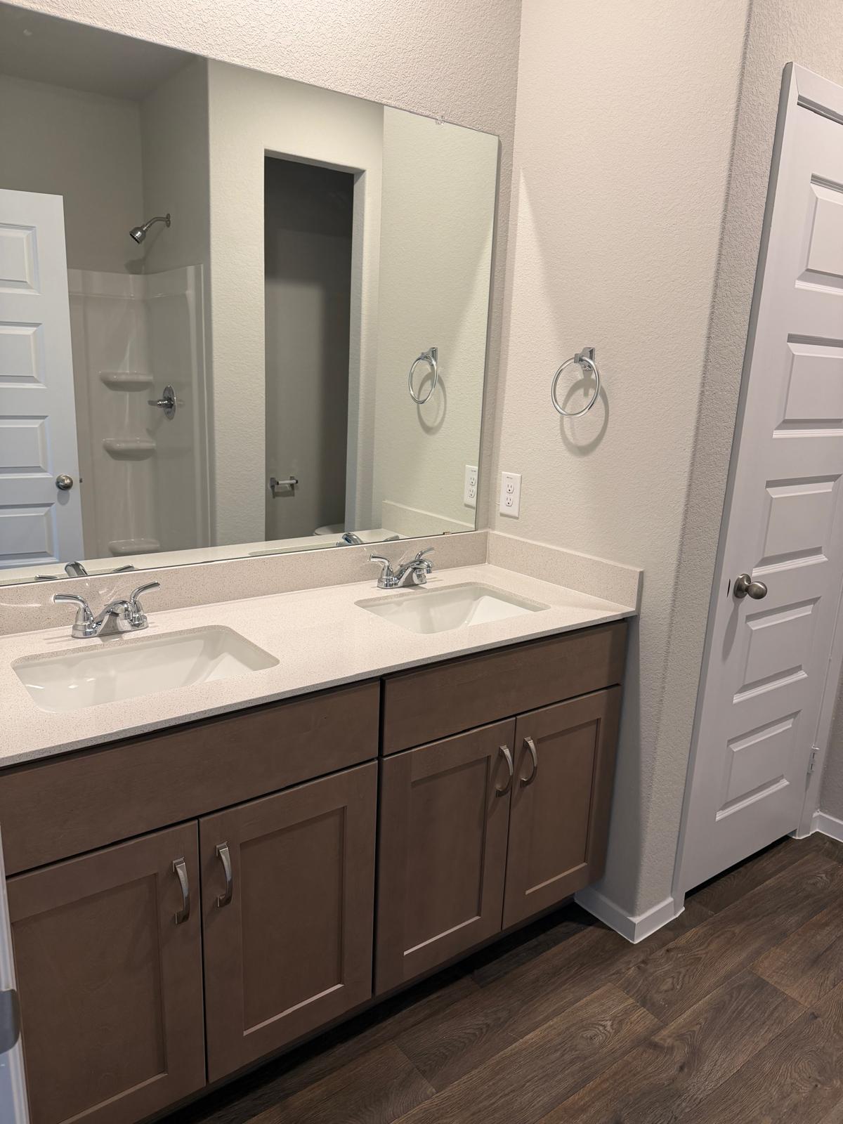 2708 Towy Road Pflugerville, TX 78660 - Photo 19 of 34 a bathroom with a double vanity sink and large mirror