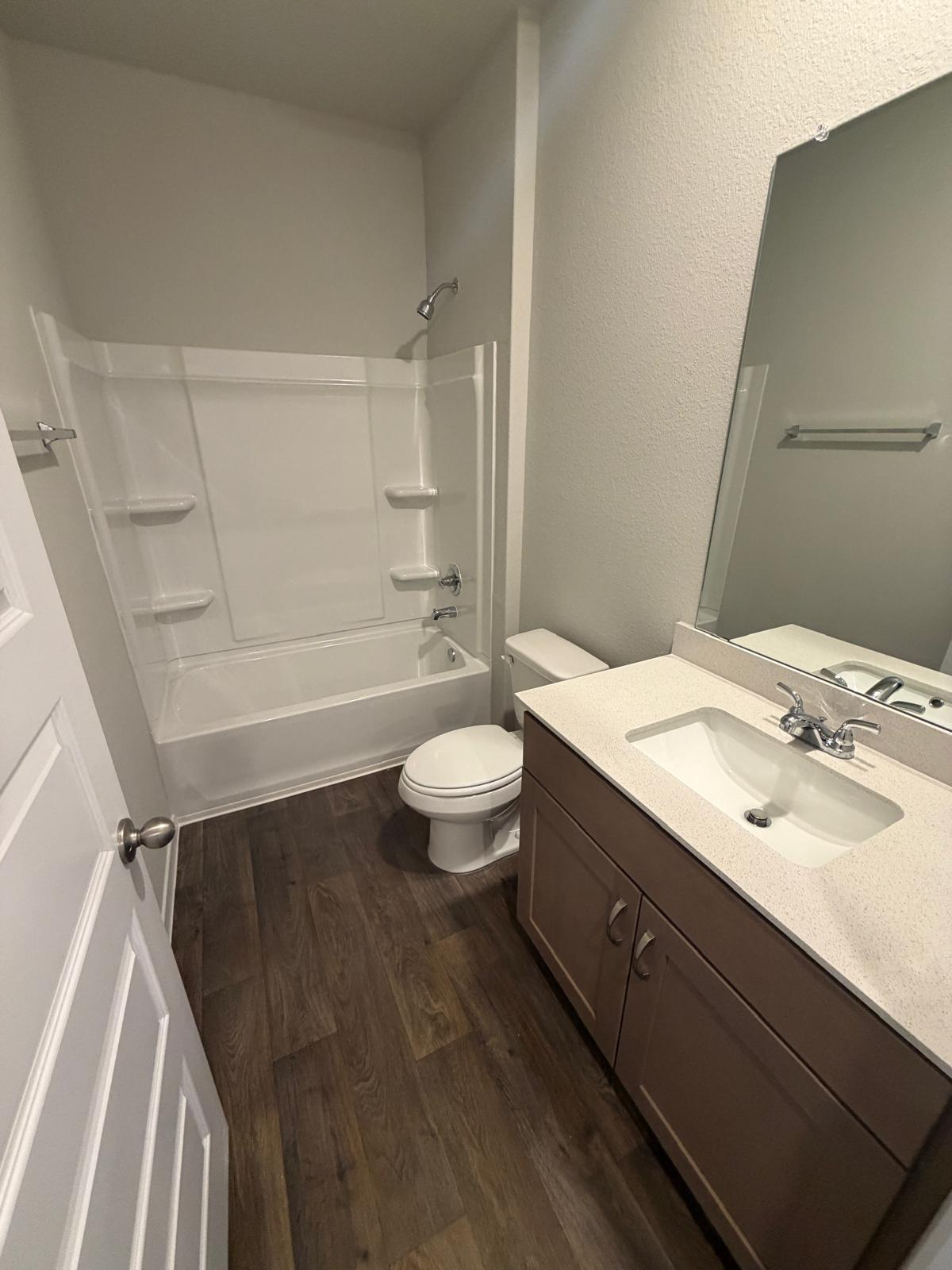 2708 Towy Road Pflugerville, TX 78660 - Photo 32 of 34 a bathroom with a sink a toilet and a bathtub