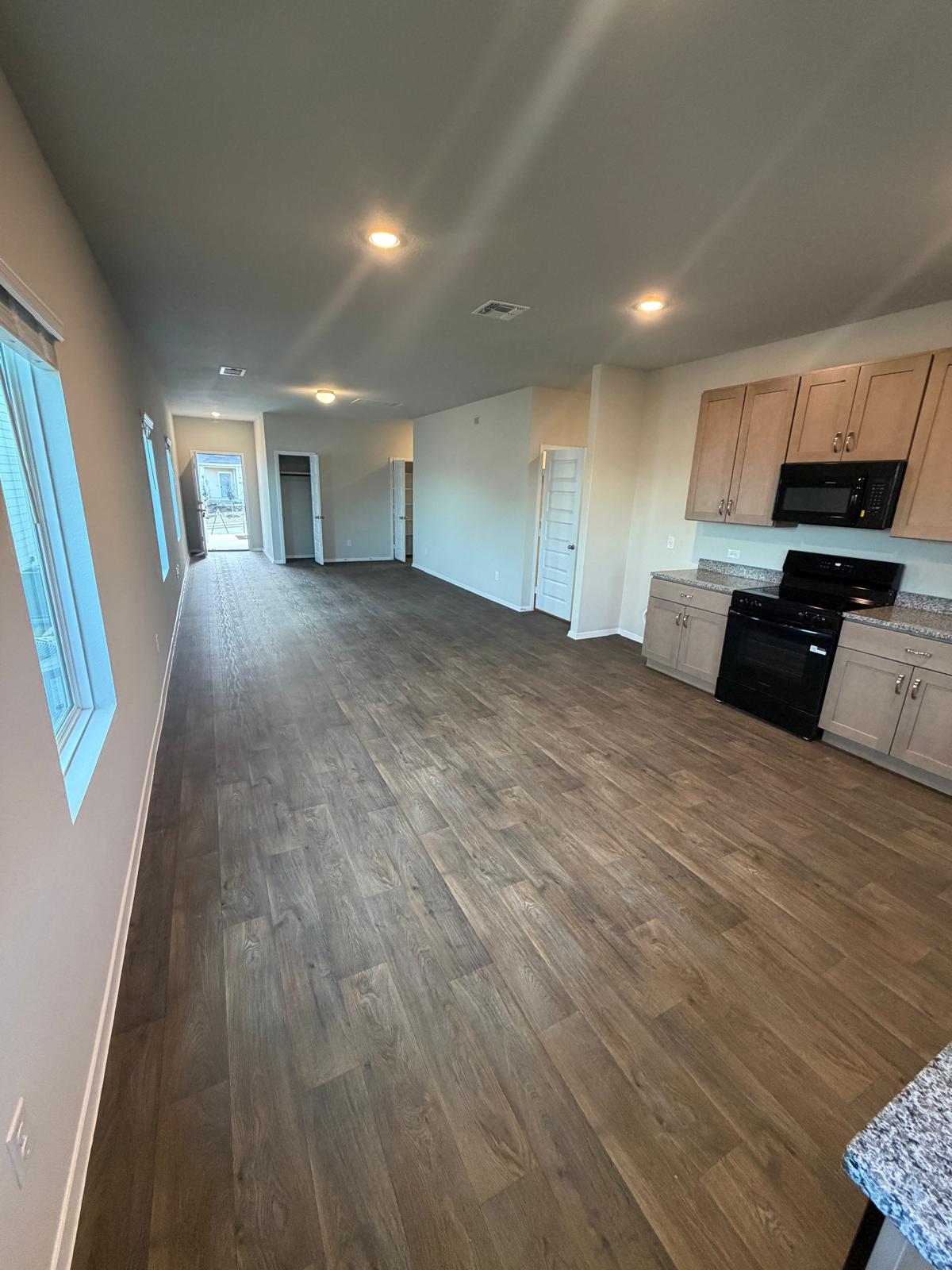2708 Towy Road Pflugerville, TX 78660 - Photo 34 of 34 a view of empty room with wooden floor and window