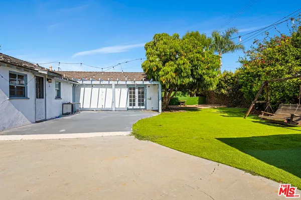 a view of a house with a yard and garage