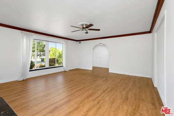 a view of livingroom with fireplace wooden floor and window