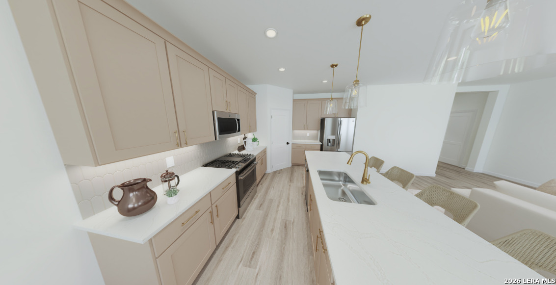 415 Nottabi Road Adkins, TX 78101 - Photo 6 of 7 a living room with furniture a flat screen tv and kitchen view