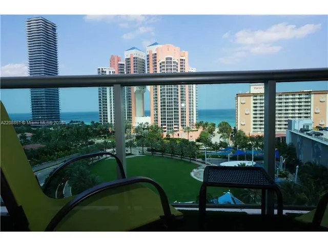 a view of a chair and table in the balcony