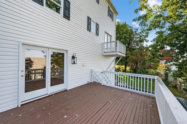 a view of deck with wooden floor and fence