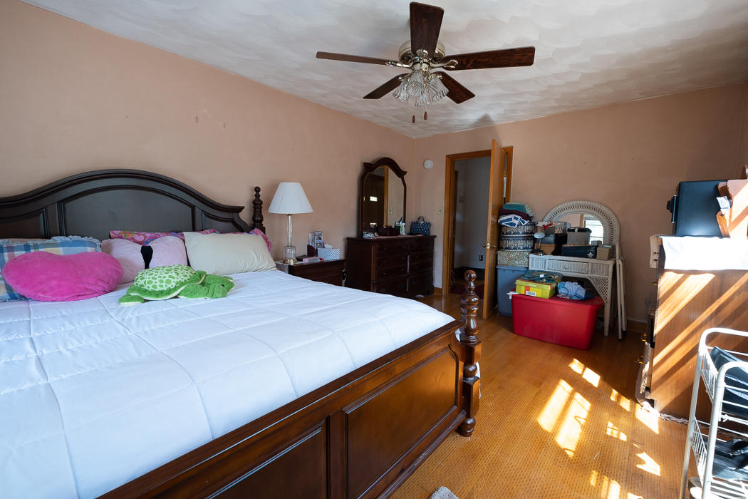 3147 Blue Ridge Boulevard Blue Ridge, VA 24064 - Photo 15 of 57 a bedroom with a bed and a chandelier